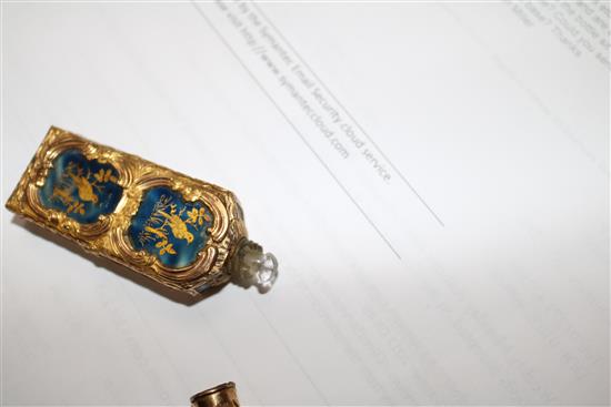 An early 20th century continental gold overlaid enamelled glass scent bottle, 75mm.